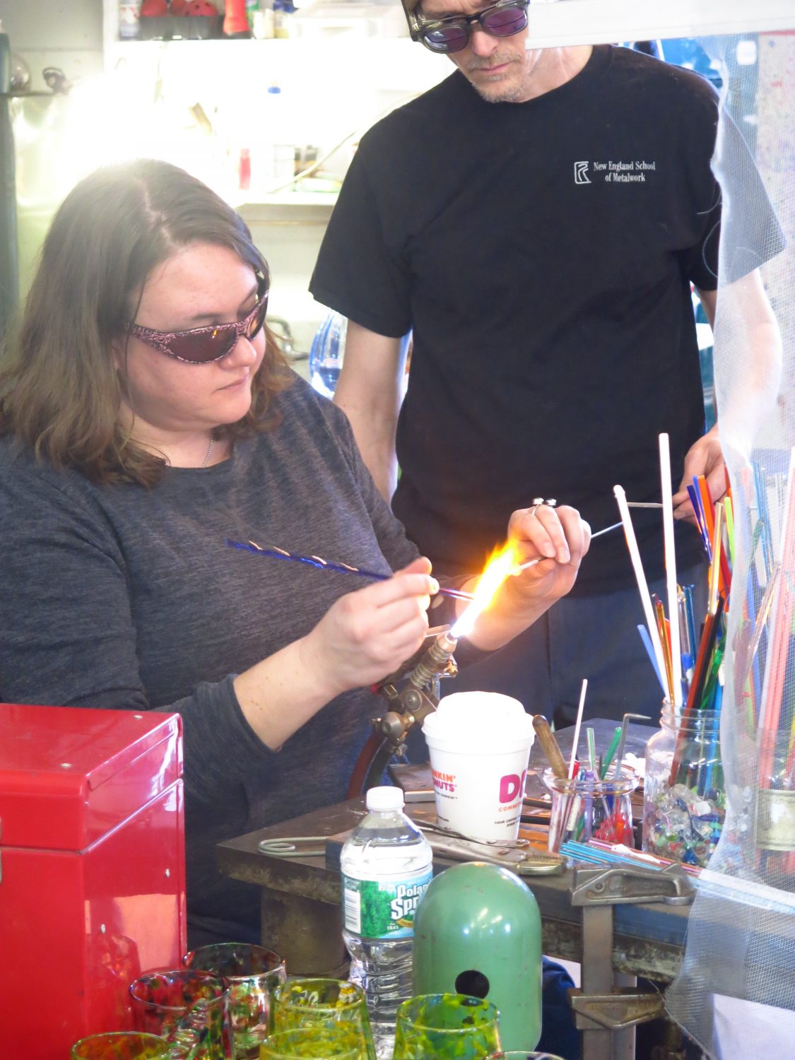 Tara working the glass in the flame.
