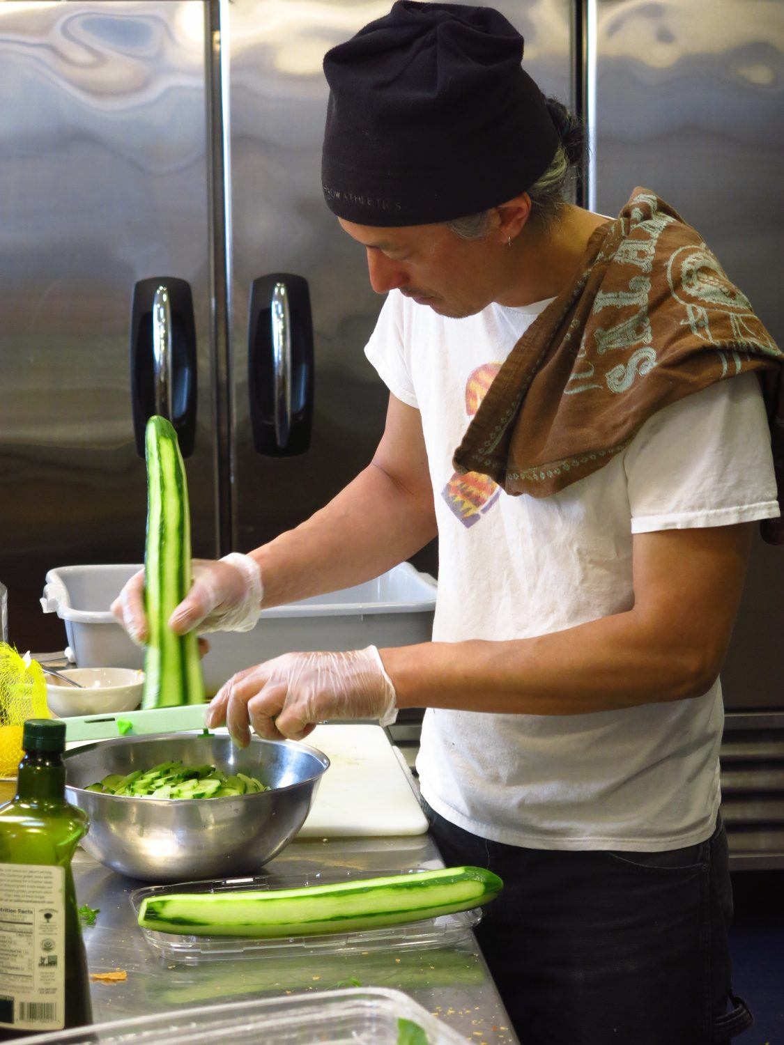 Board member Jon Ho preparing dinner